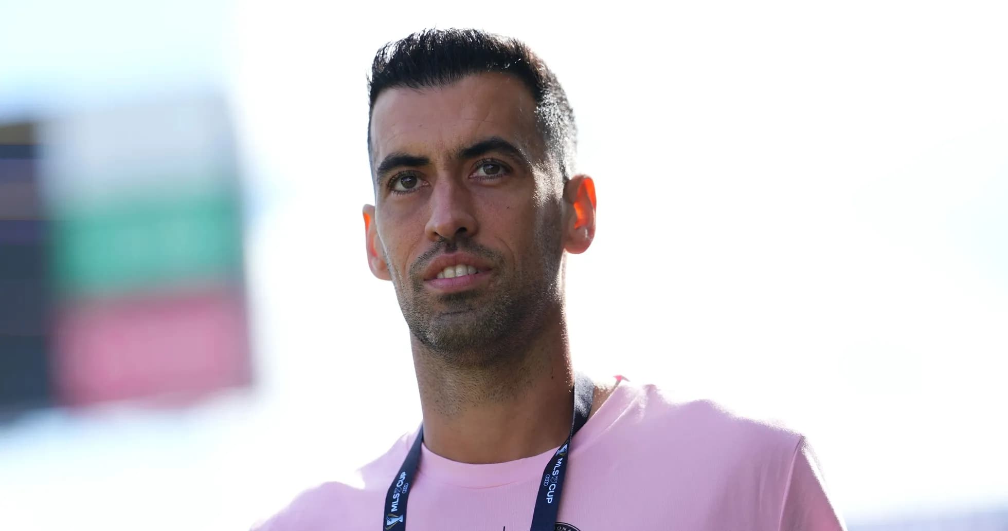 Player in a pink shirt at stadium entrance Player in a pink shirt at stadium entrance
