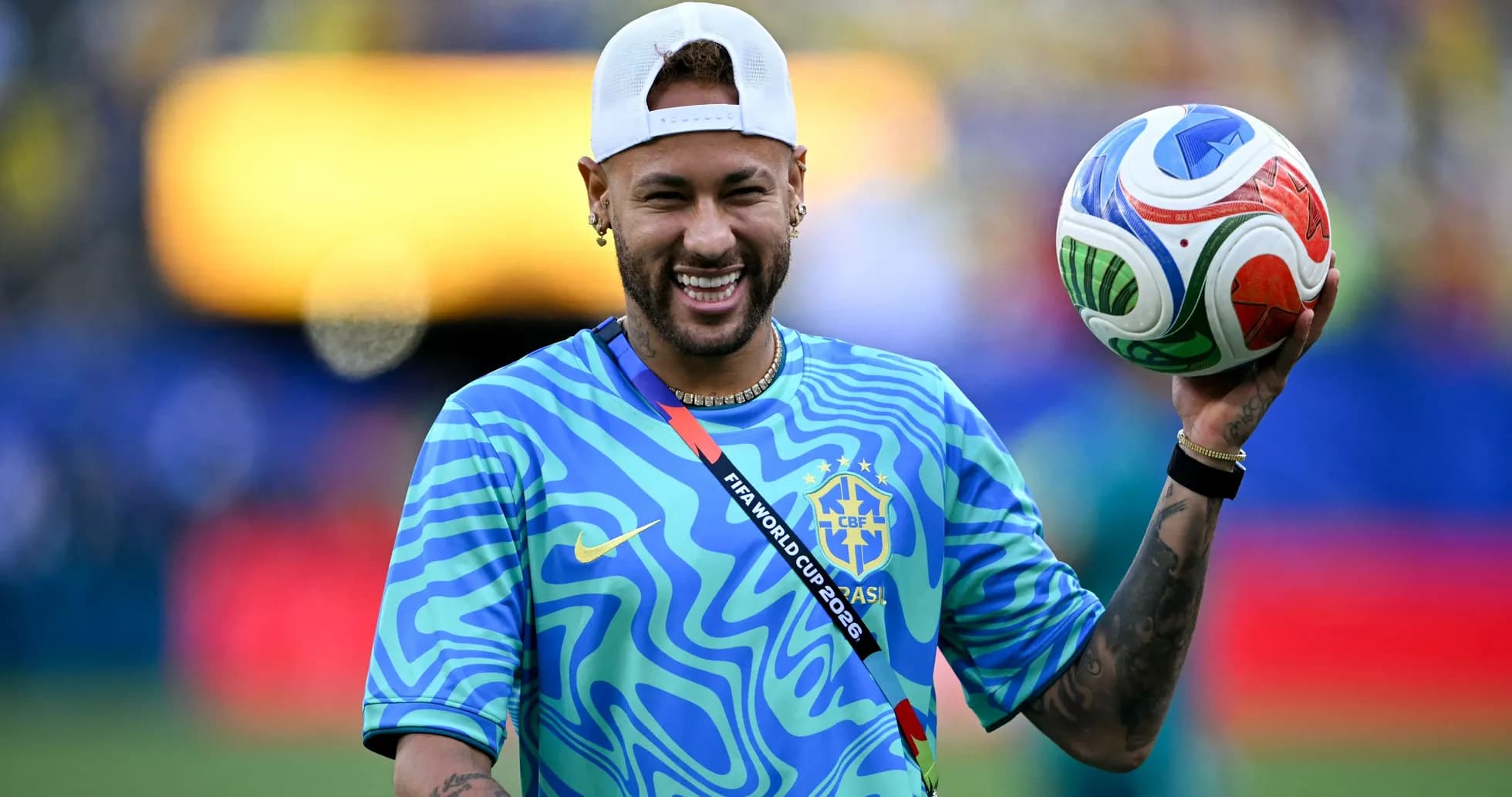 Player holding a soccer ball at the stadium Player holding a soccer ball at the stadium