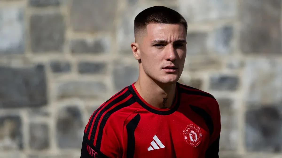 Player in Manchester United training kit posing outdoors Player in Manchester United training kit posing outdoors