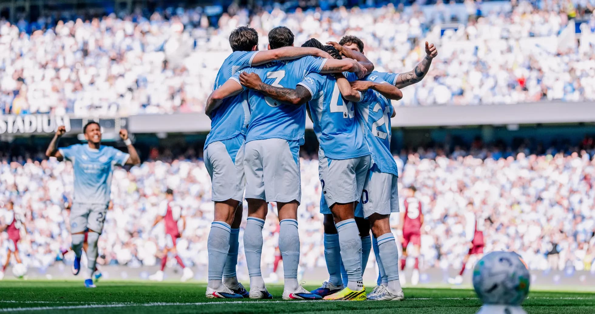 Manchester City players celebrating a goal Manchester City players celebrating a goal