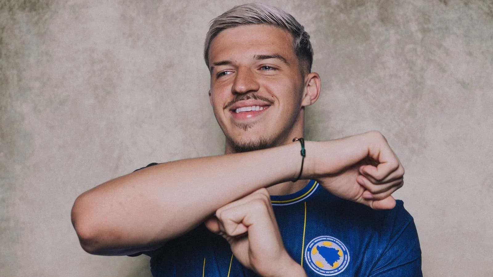 Player smiling and posing in national team jersey Player smiling and posing in national team jersey