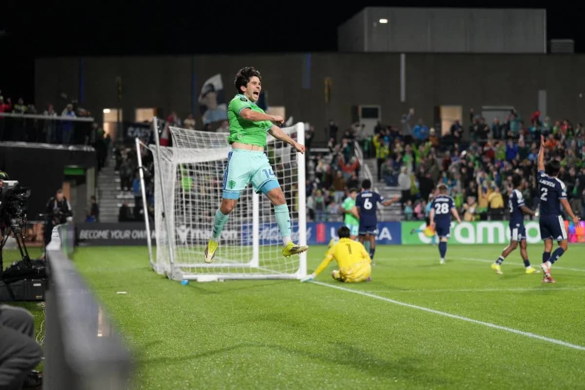 Player celebrating a goal during Seattle Sounders match Player celebrating a goal during Seattle Sounders match