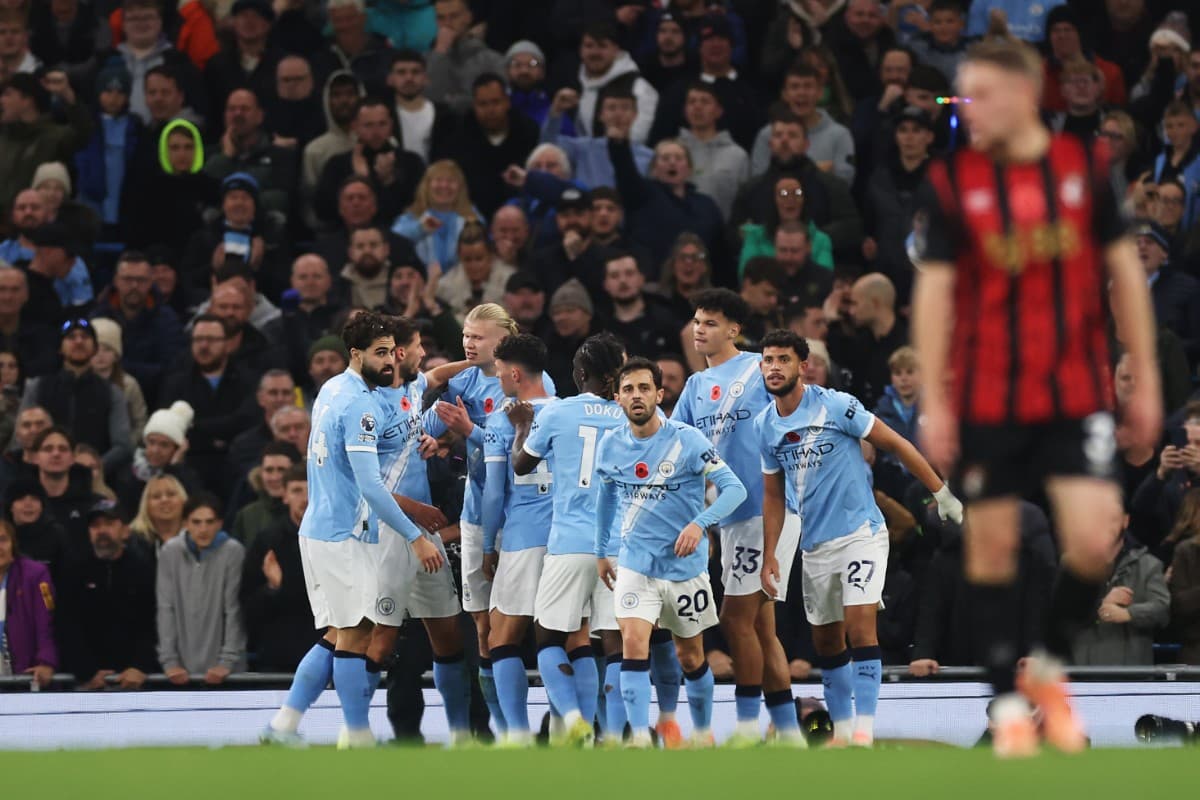 Manchester City players celebrate a goal Manchester City players celebrate a goal