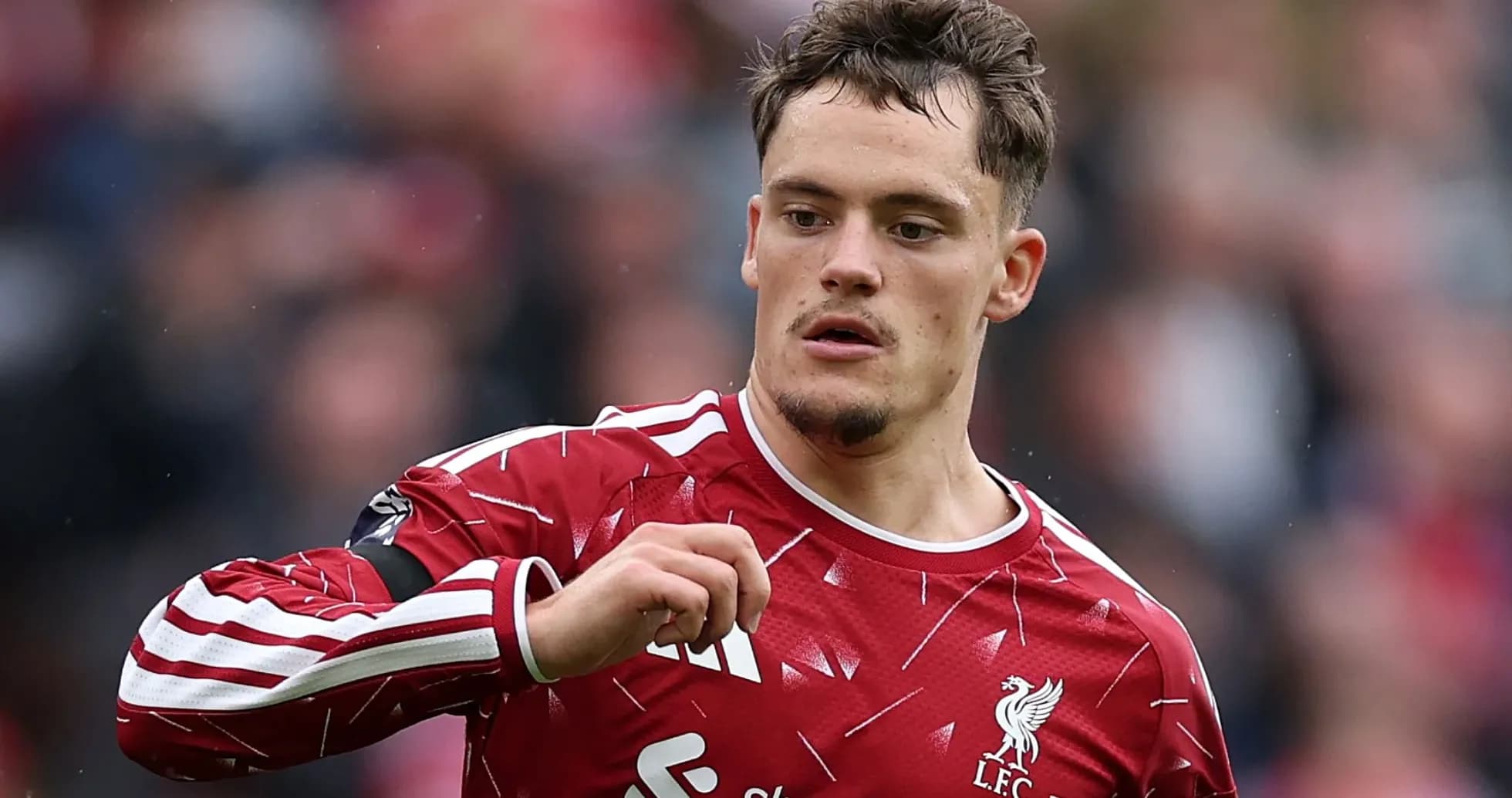 Player in Liverpool jersey gesturing during match Player in Liverpool jersey gesturing during match