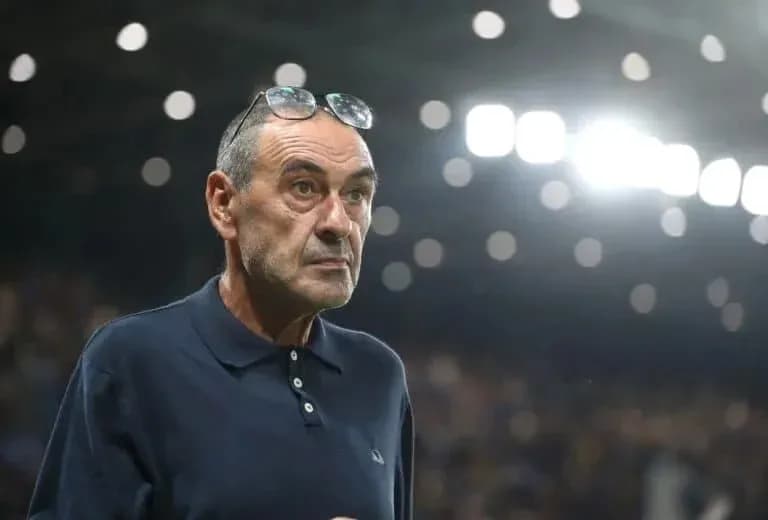 Coach observing the match with glasses on head Coach observing the match with glasses on head