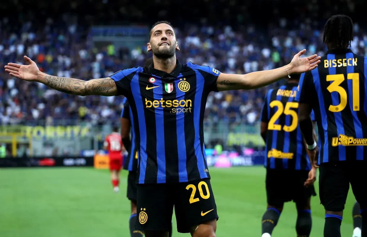 Player celebrating a goal with teammates on field Player celebrating a goal with teammates on field