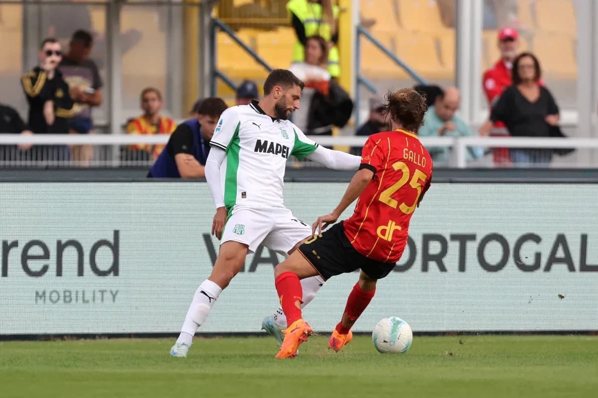 Sassuolo player challenging Lecce opponent during match Sassuolo player challenging Lecce opponent during match