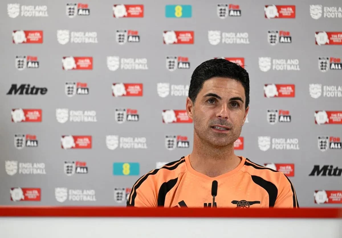 Manager speaking at press conference with backdrop Manager speaking at press conference with backdrop
