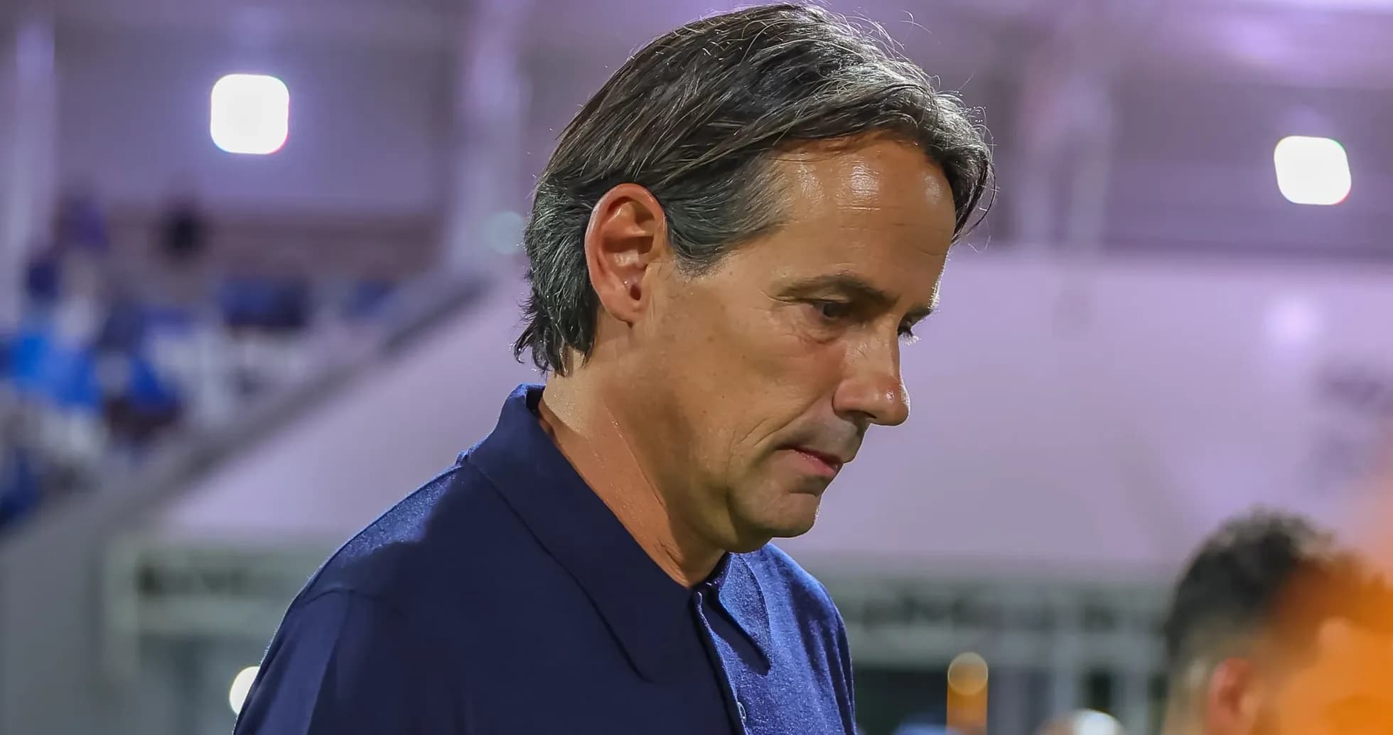 Coach walking off the pitch after match Coach walking off the pitch after match