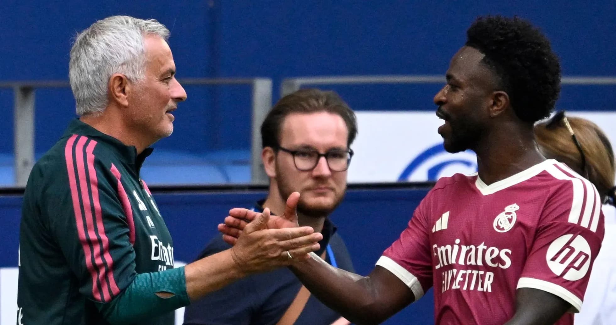 Two men shaking hands on the sidelines Two men shaking hands on the sidelines