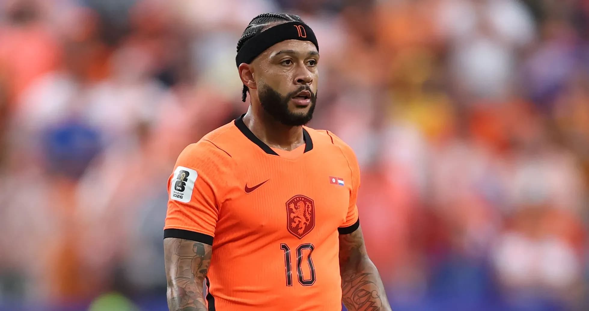 Player in orange jersey during a match Player in orange jersey during a match