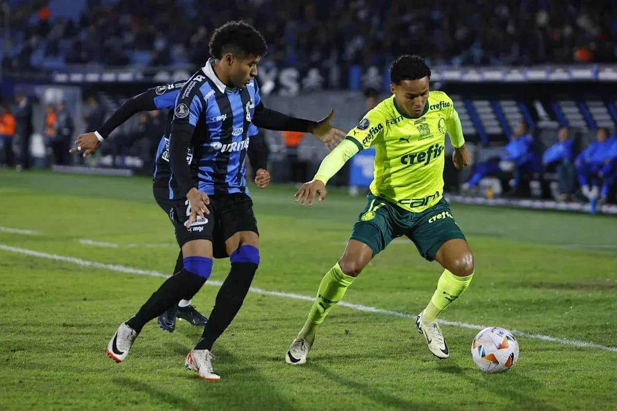 Two players contesting for the ball on the field Two players contesting for the ball on the field