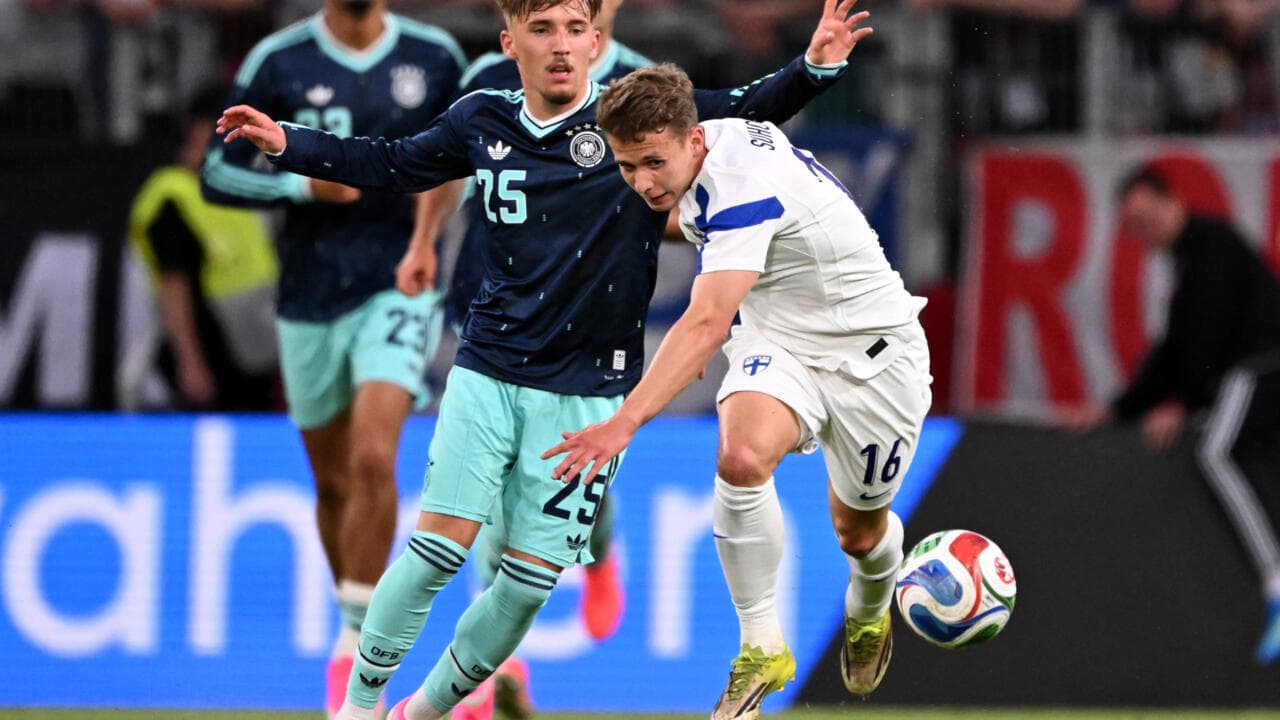 German and Finnish players contesting for the ball German and Finnish players contesting for the ball