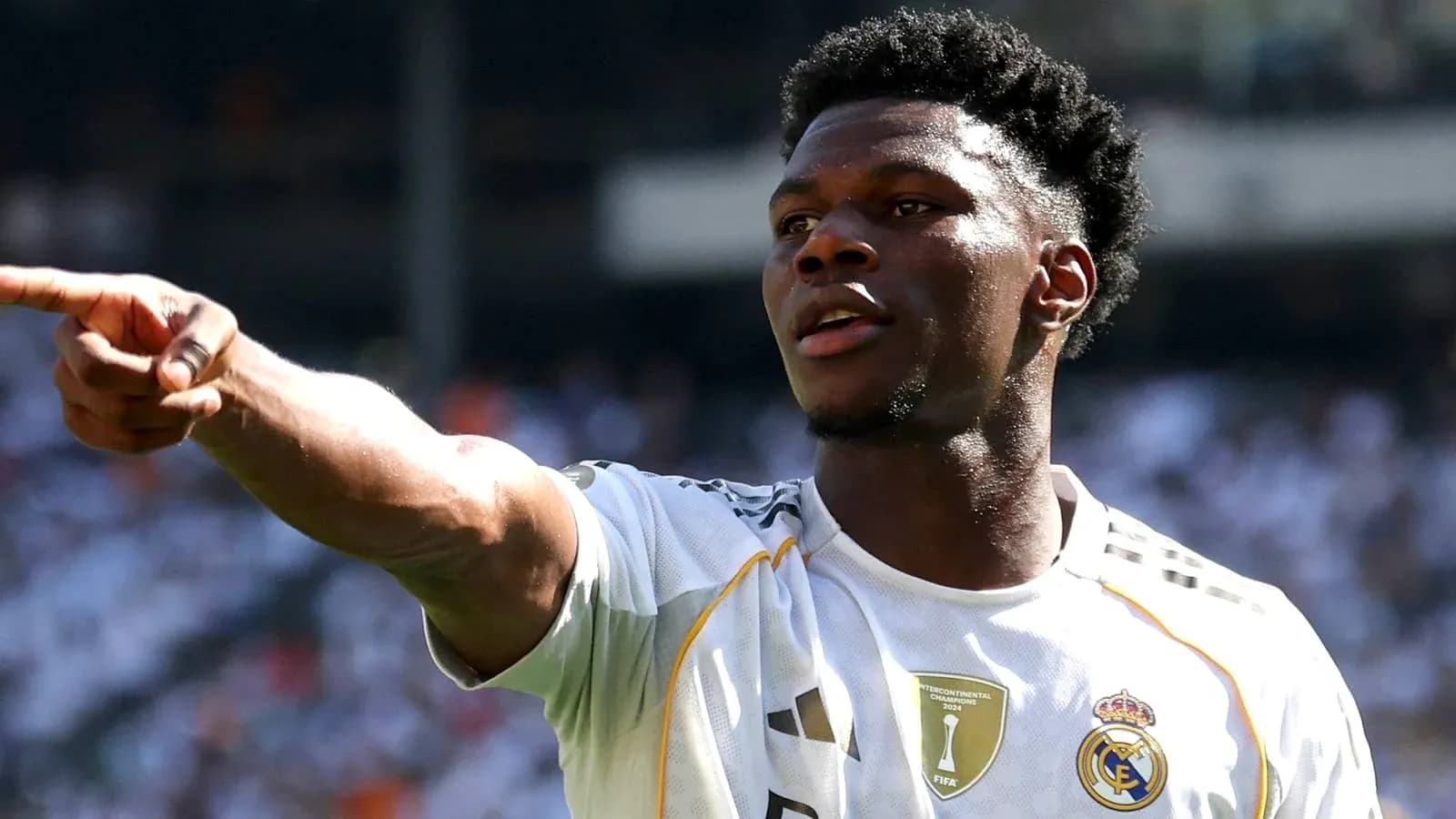 Player gesturing during match wearing Real Madrid jersey Player gesturing during match wearing Real Madrid jersey