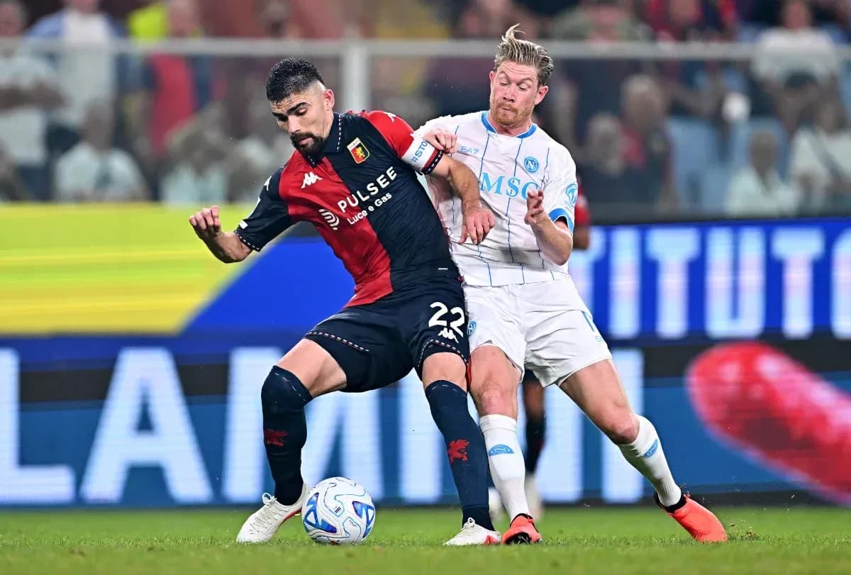 Two players contesting the ball during a match Two players contesting the ball during a match