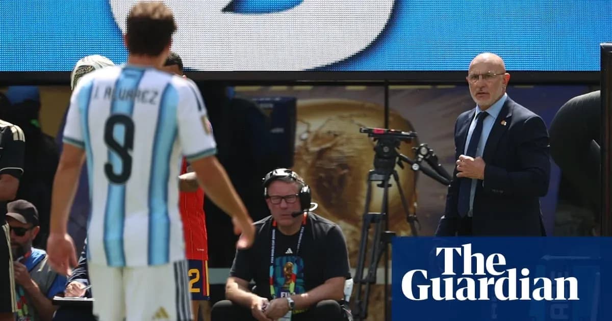 Argentinian player leaving field with coach observing Argentinian player leaving field with coach observing