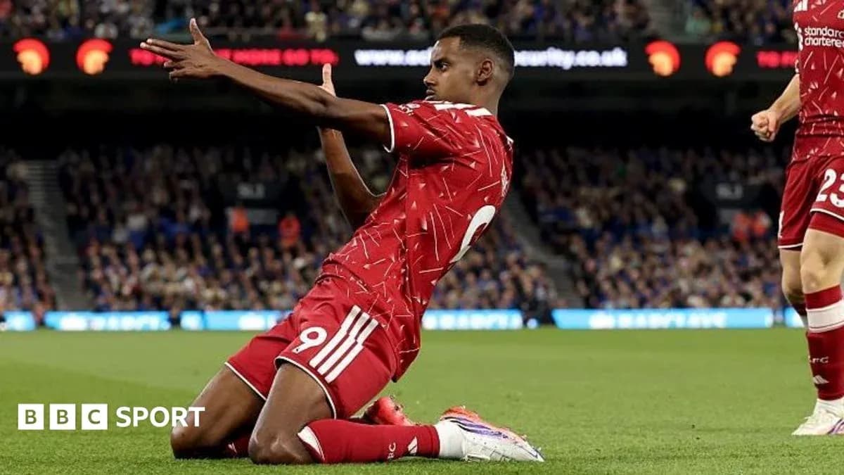 Player celebrating a goal on the pitch Player celebrating a goal on the pitch