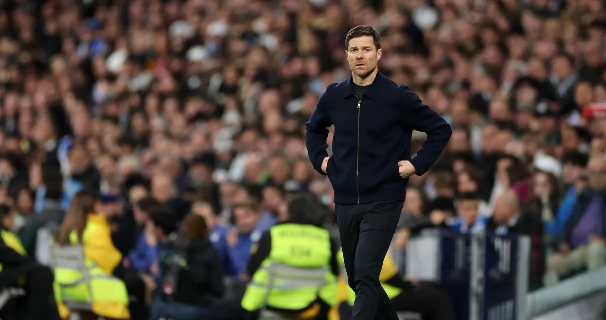 Coach walking along the sideline during match Coach walking along the sideline during match