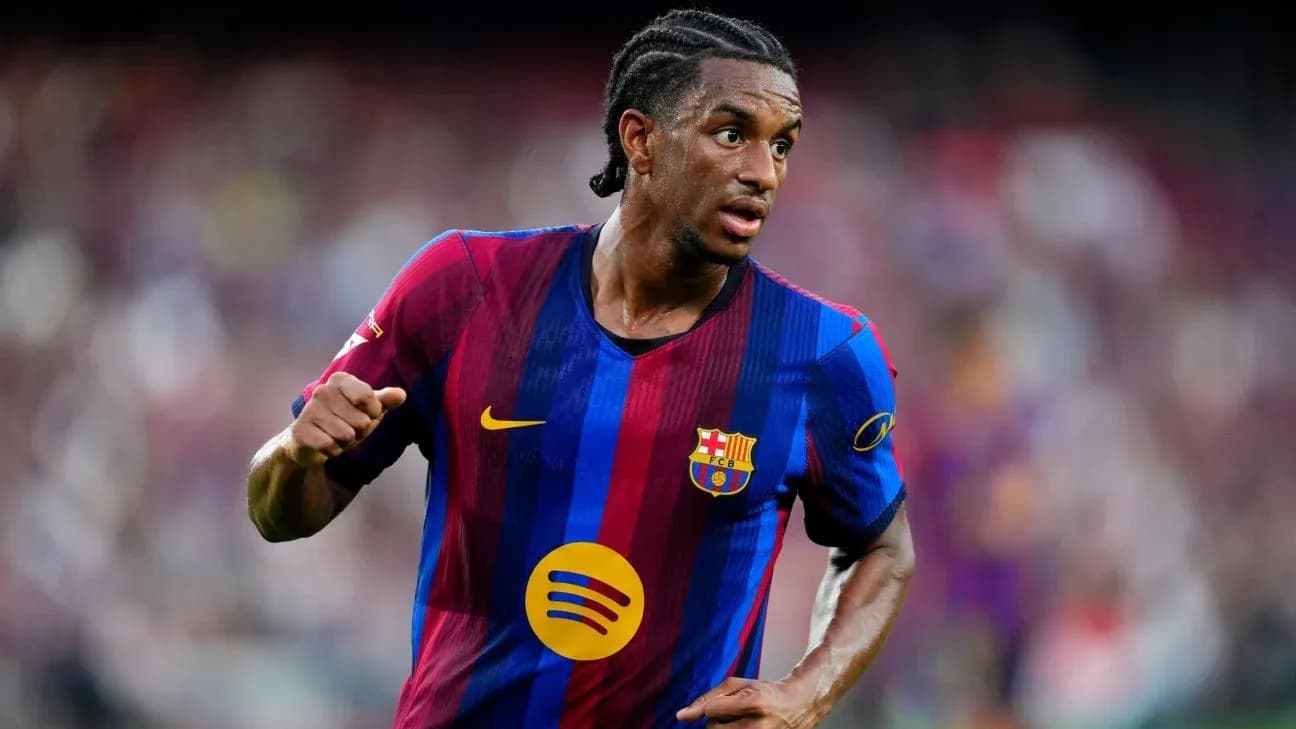 Player in FC Barcelona kit running on field Player in FC Barcelona kit running on field