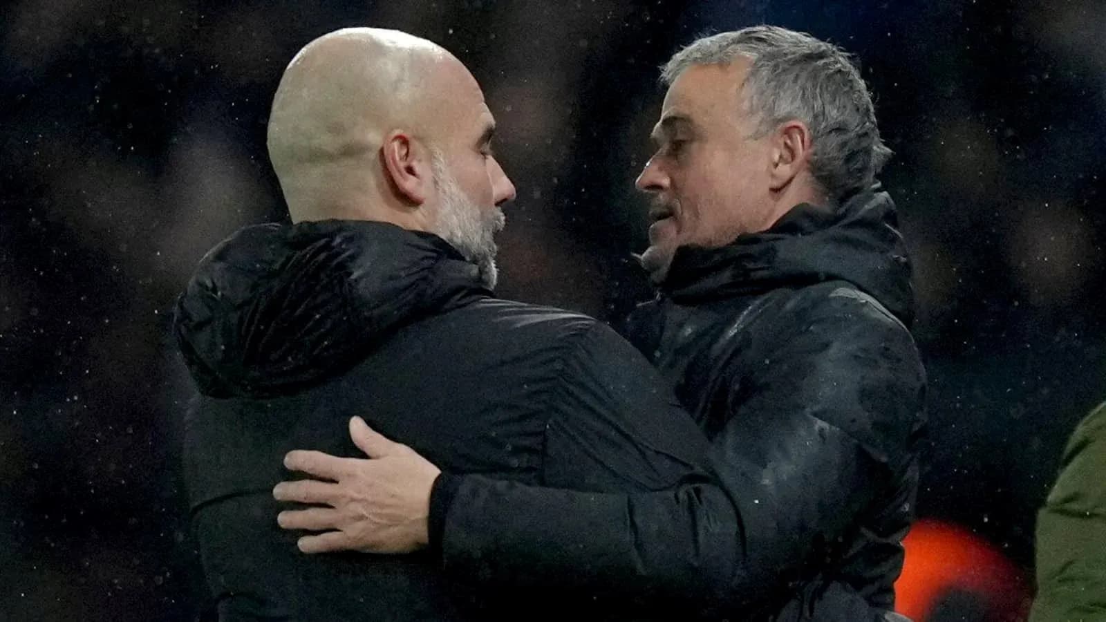 Two coaches embracing after a match Two coaches embracing after a match