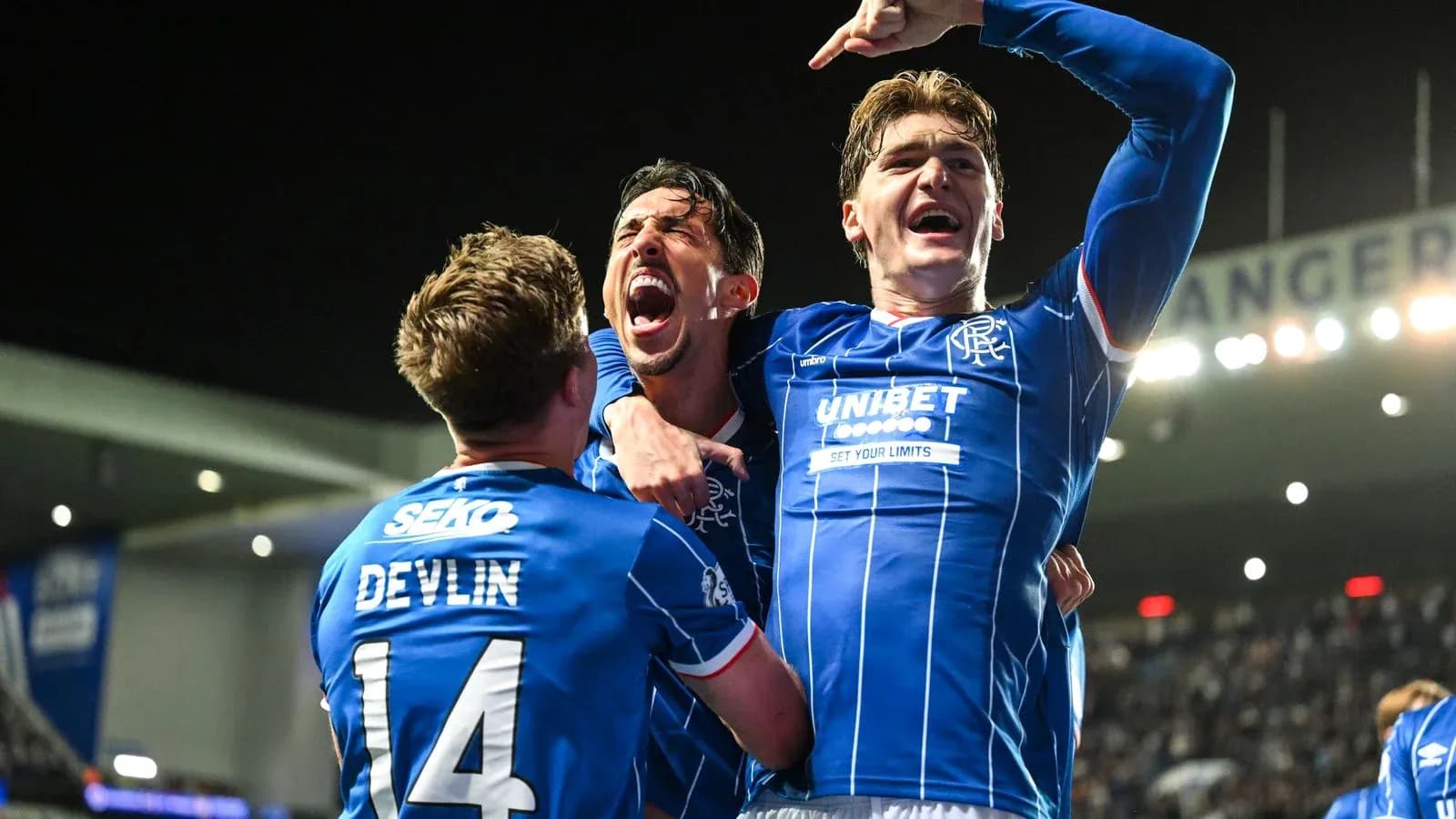 Rangers players celebrating a goal together Rangers players celebrating a goal together