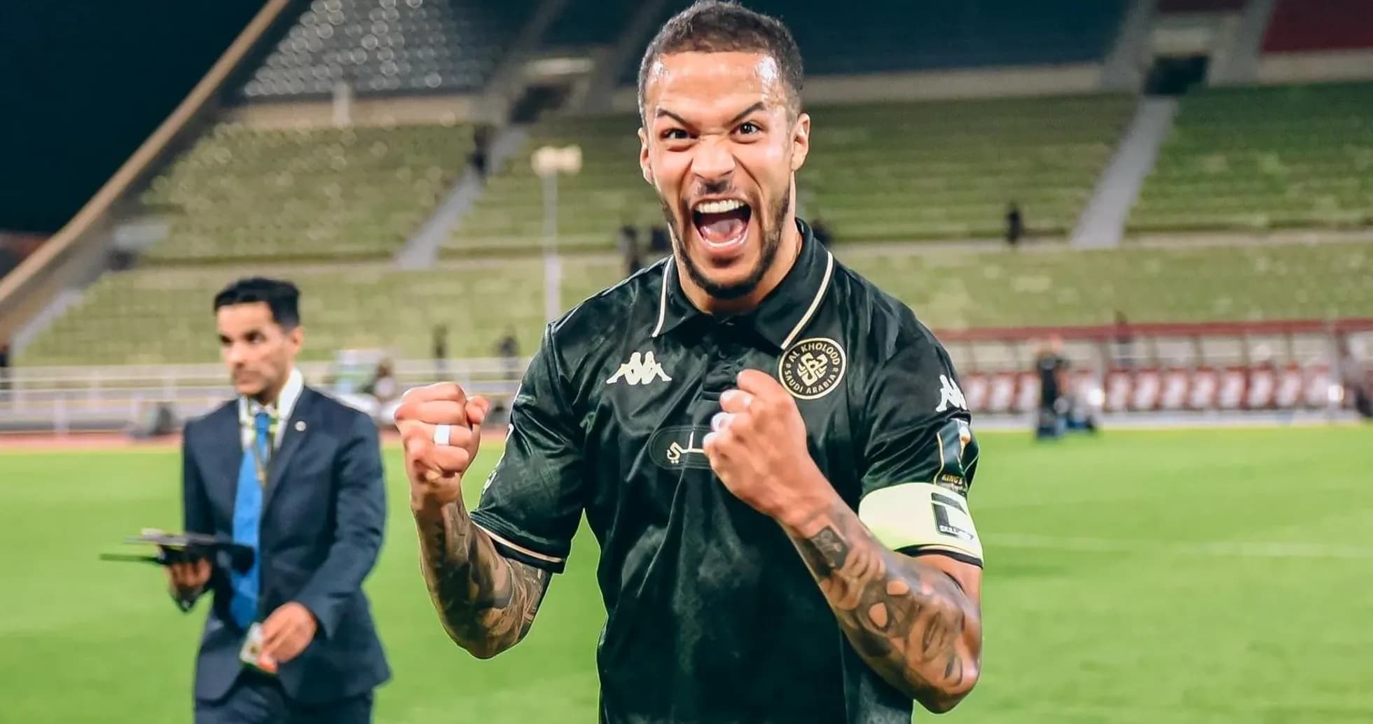 Al Kholood player celebrating victory on the pitch Al Kholood player celebrating victory on the pitch