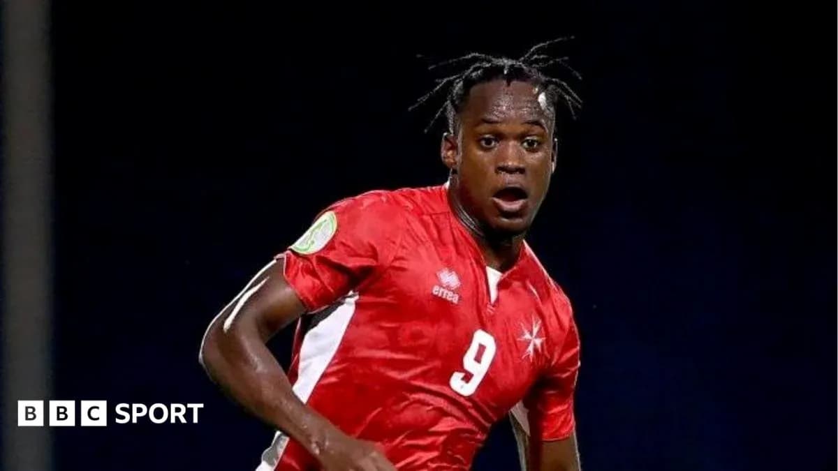 Player in red jersey sprinting on the field Player in red jersey sprinting on the field