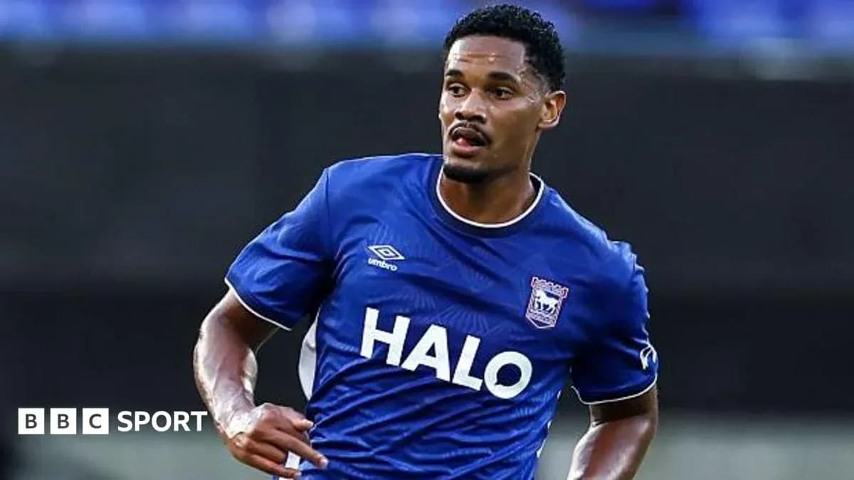 Player in blue jersey running on the field Player in blue jersey running on the field