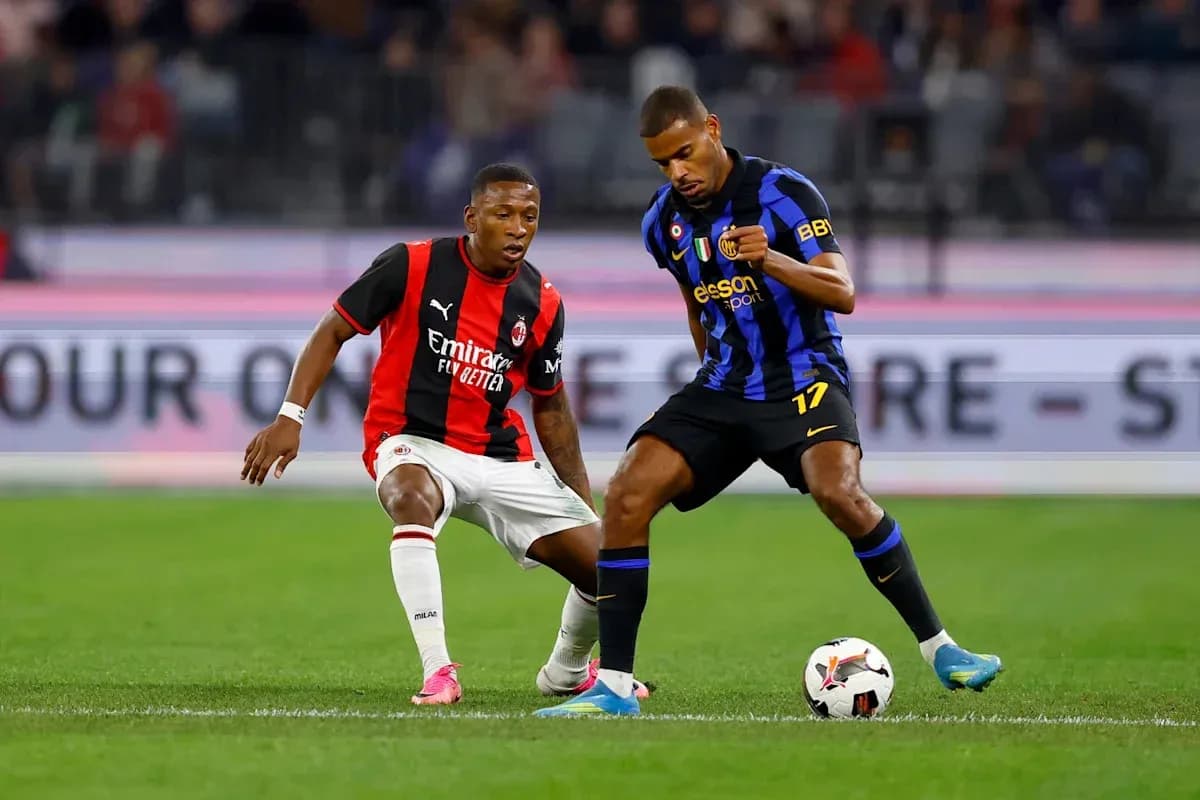 Two players contesting for the ball during match Two players contesting for the ball during match