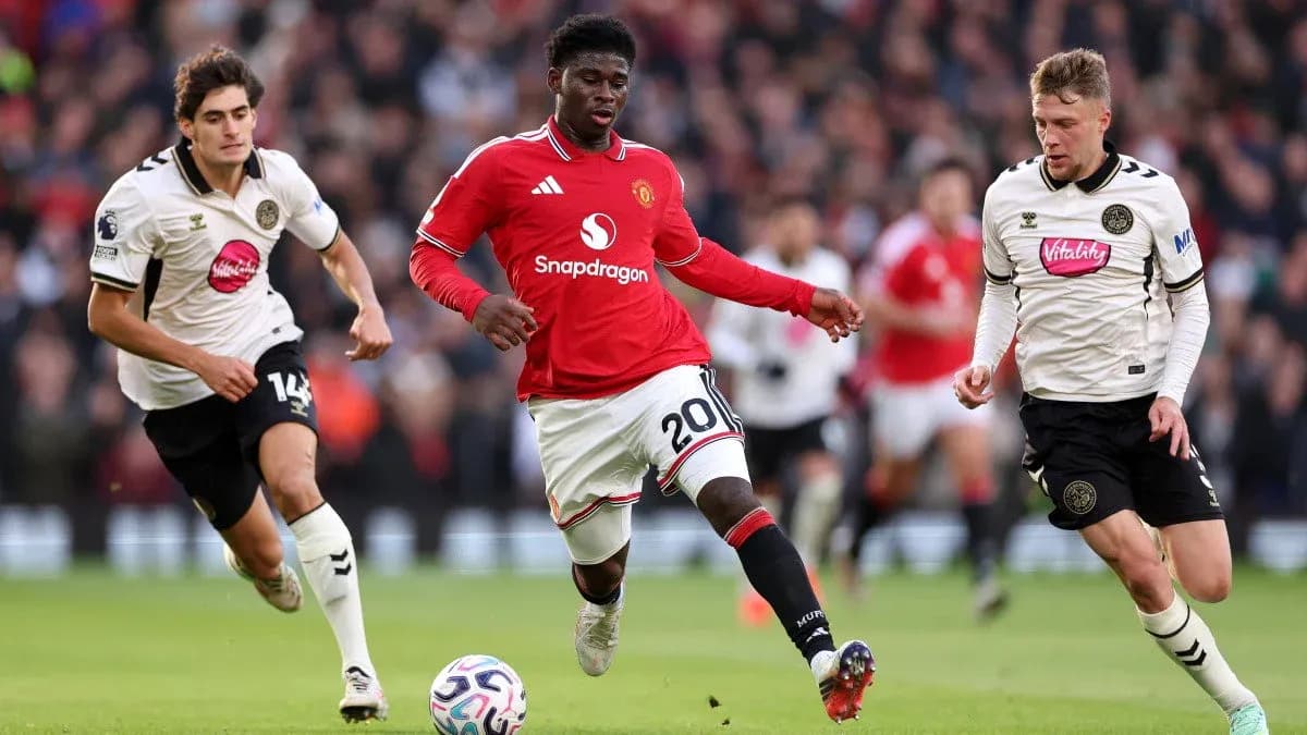 Manchester United player dribbling past Bournemouth defenders Manchester United player dribbling past Bournemouth defenders