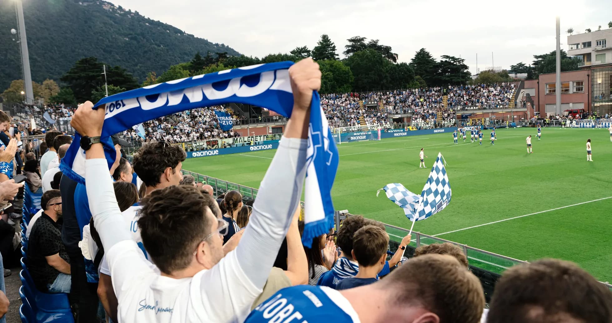 Fans celebrating during Como vs Venezia match Fans celebrating during Como vs Venezia match