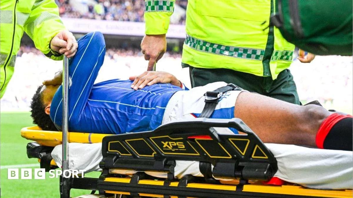 Player being stretchered off the field by medics Player being stretchered off the field by medics