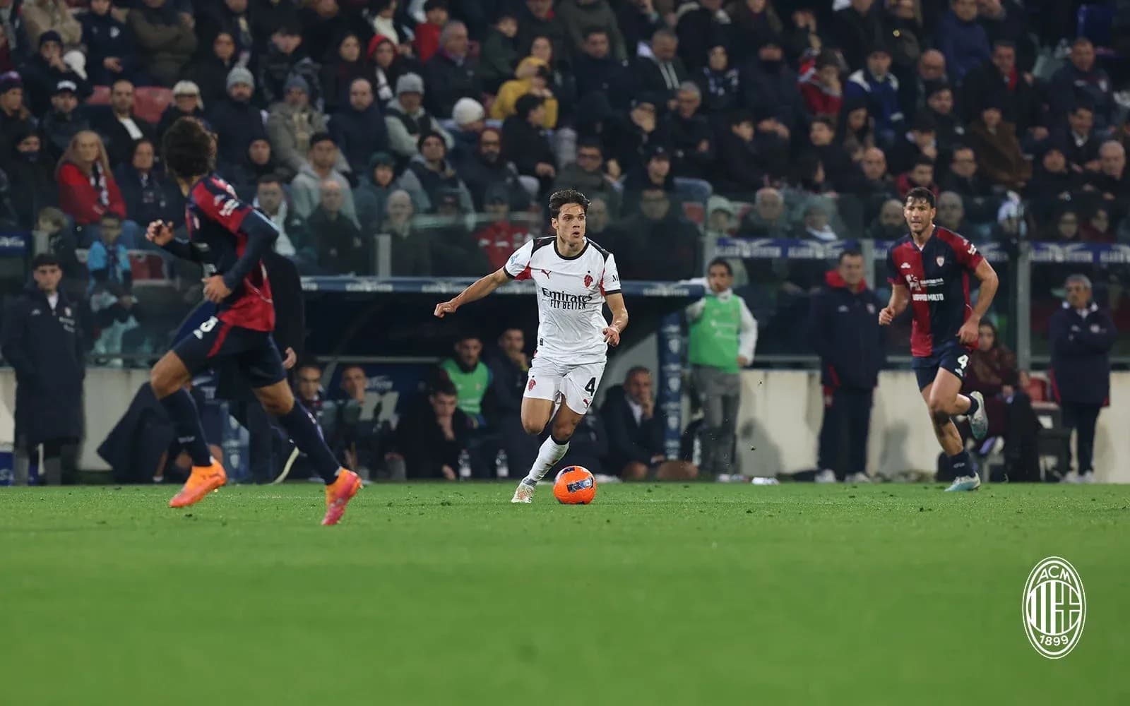 AC Milan player dribbling during match against Cagliari AC Milan player dribbling during match against Cagliari