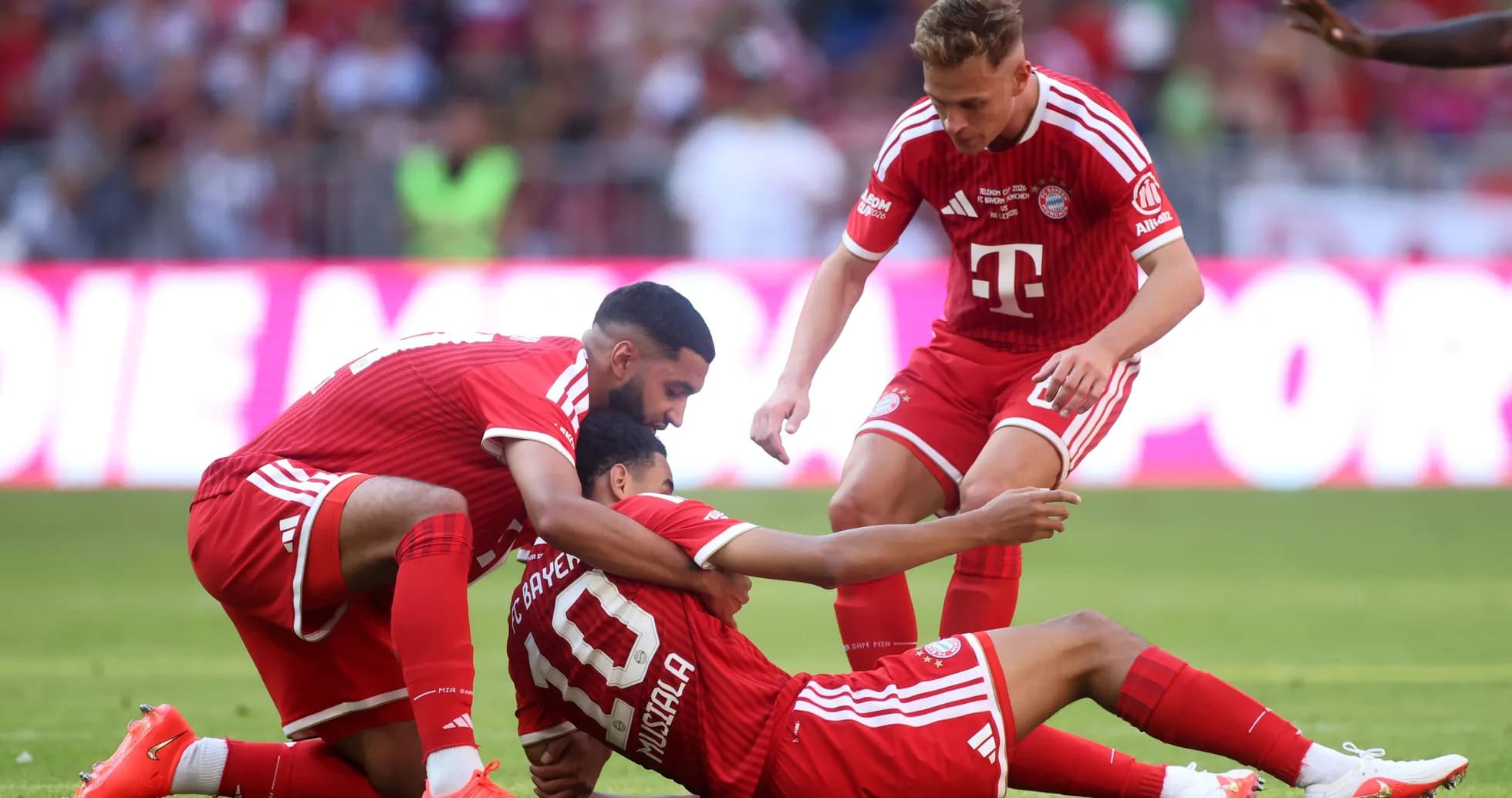 Bayern Munich players celebrating a goal on the field Bayern Munich players celebrating a goal on the field