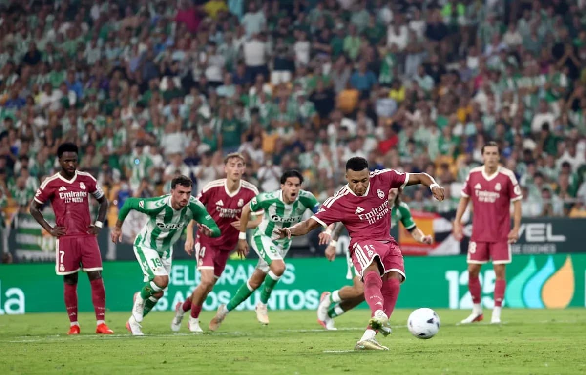 Player taking penalty kick during football match Player taking penalty kick during football match