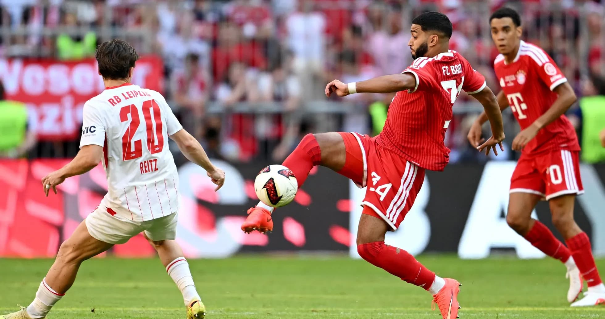 Player passing the ball during a football match Player passing the ball during a football match
