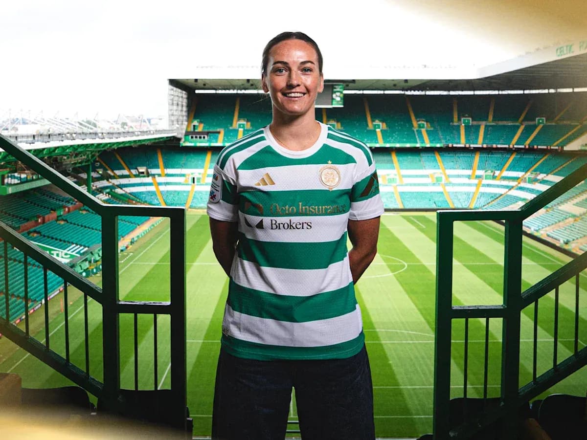 Player posing in Celtic jersey at stadium Player posing in Celtic jersey at stadium