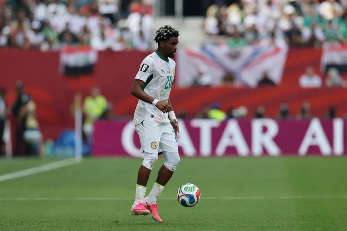 Player from Senegal controlling the ball during match Player from Senegal controlling the ball during match
