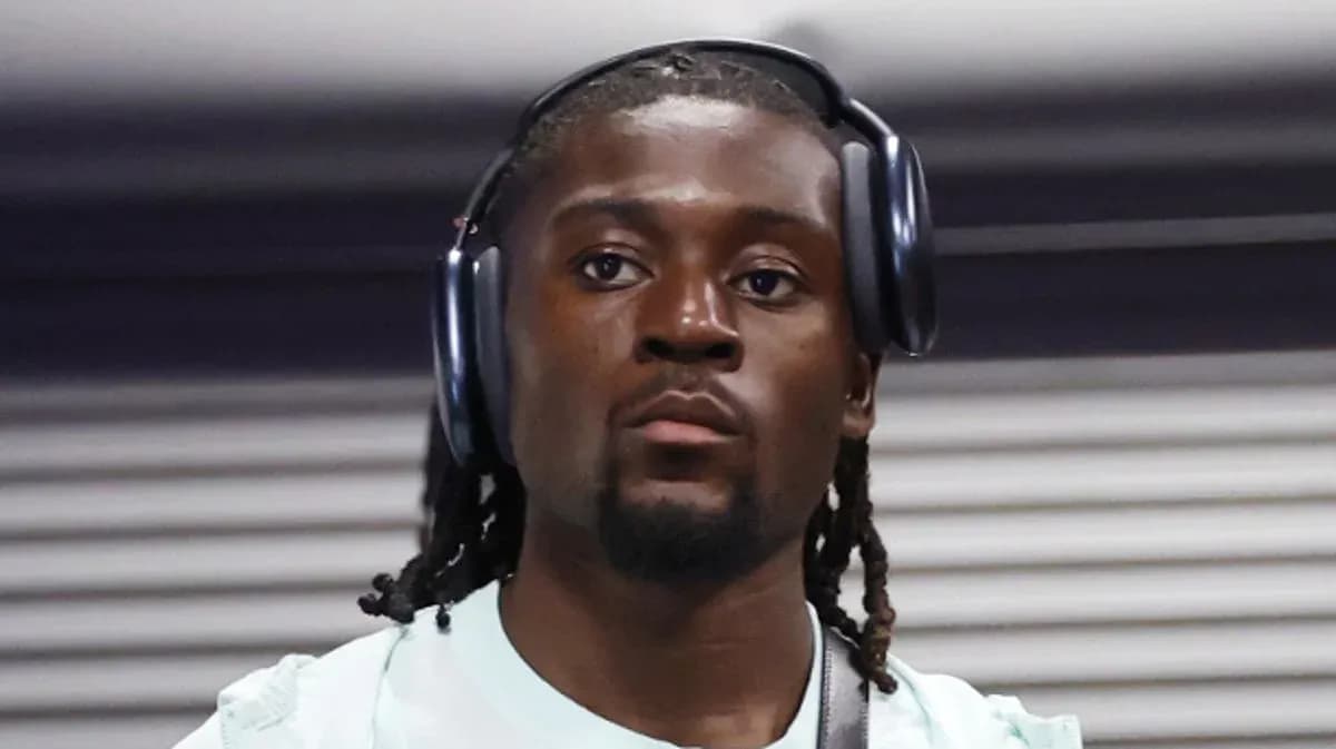 Player wearing headphones while walking indoors Player wearing headphones while walking indoors