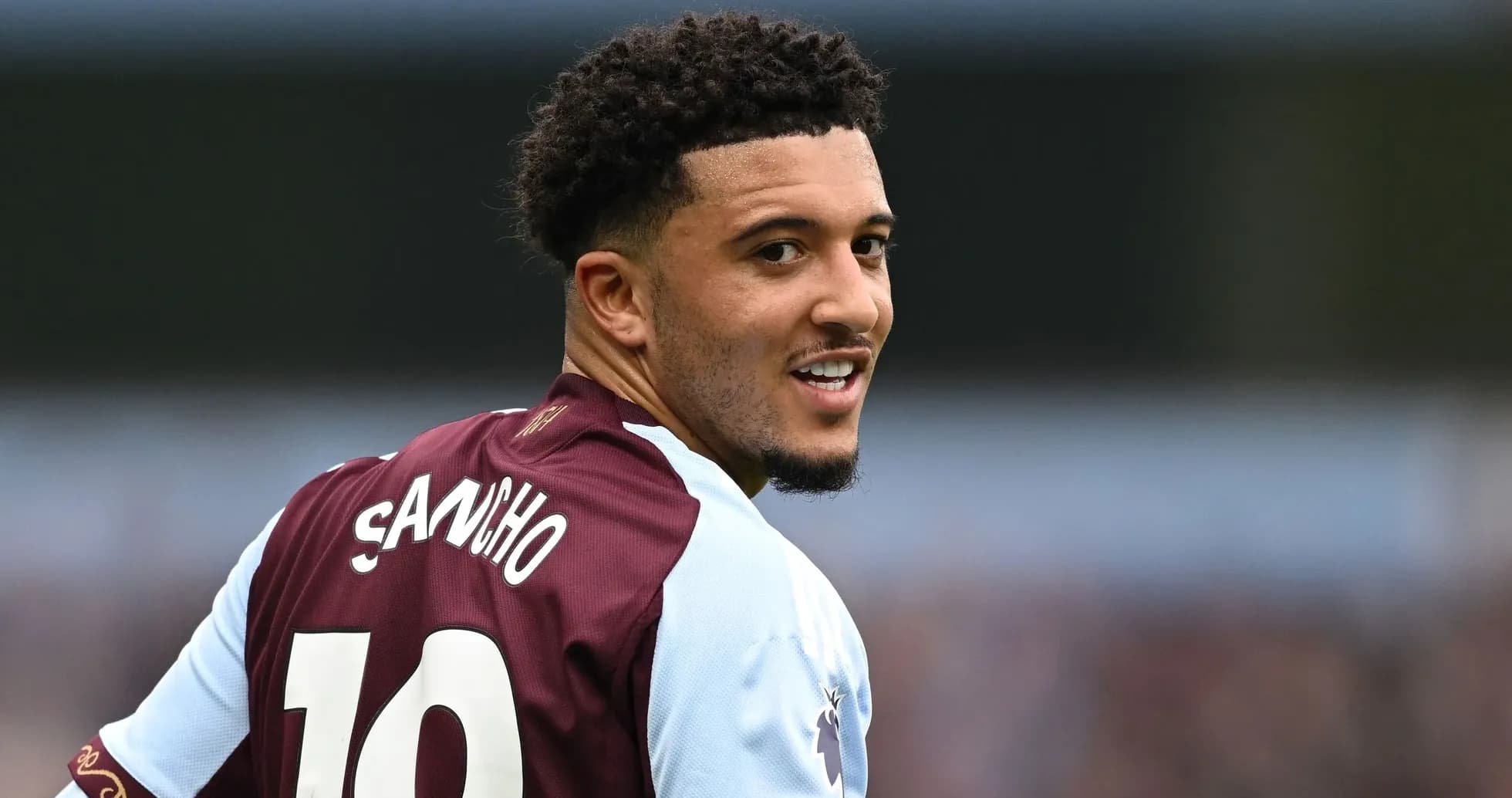 Player wearing number 10 jersey, smiling at camera Player wearing number 10 jersey, smiling at camera