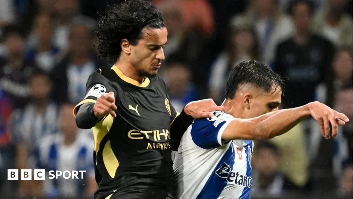 Two players clashing during a football match action Two players clashing during a football match action