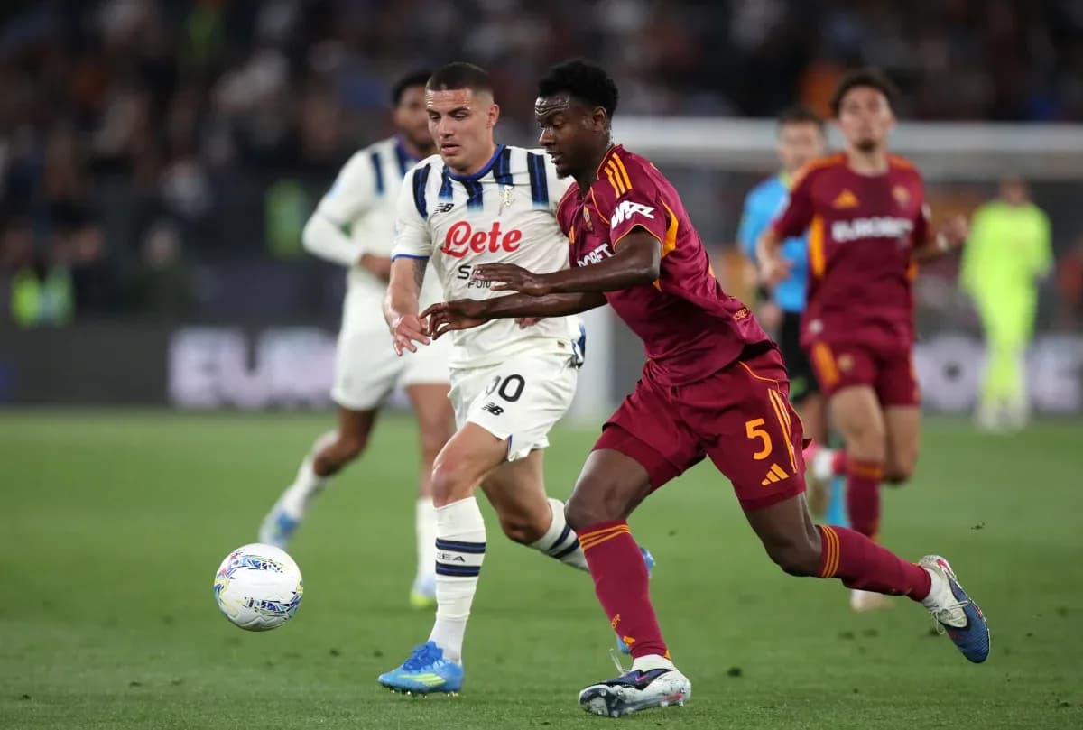 AS Roma player challenging Atalanta opponent for ball AS Roma player challenging Atalanta opponent for ball