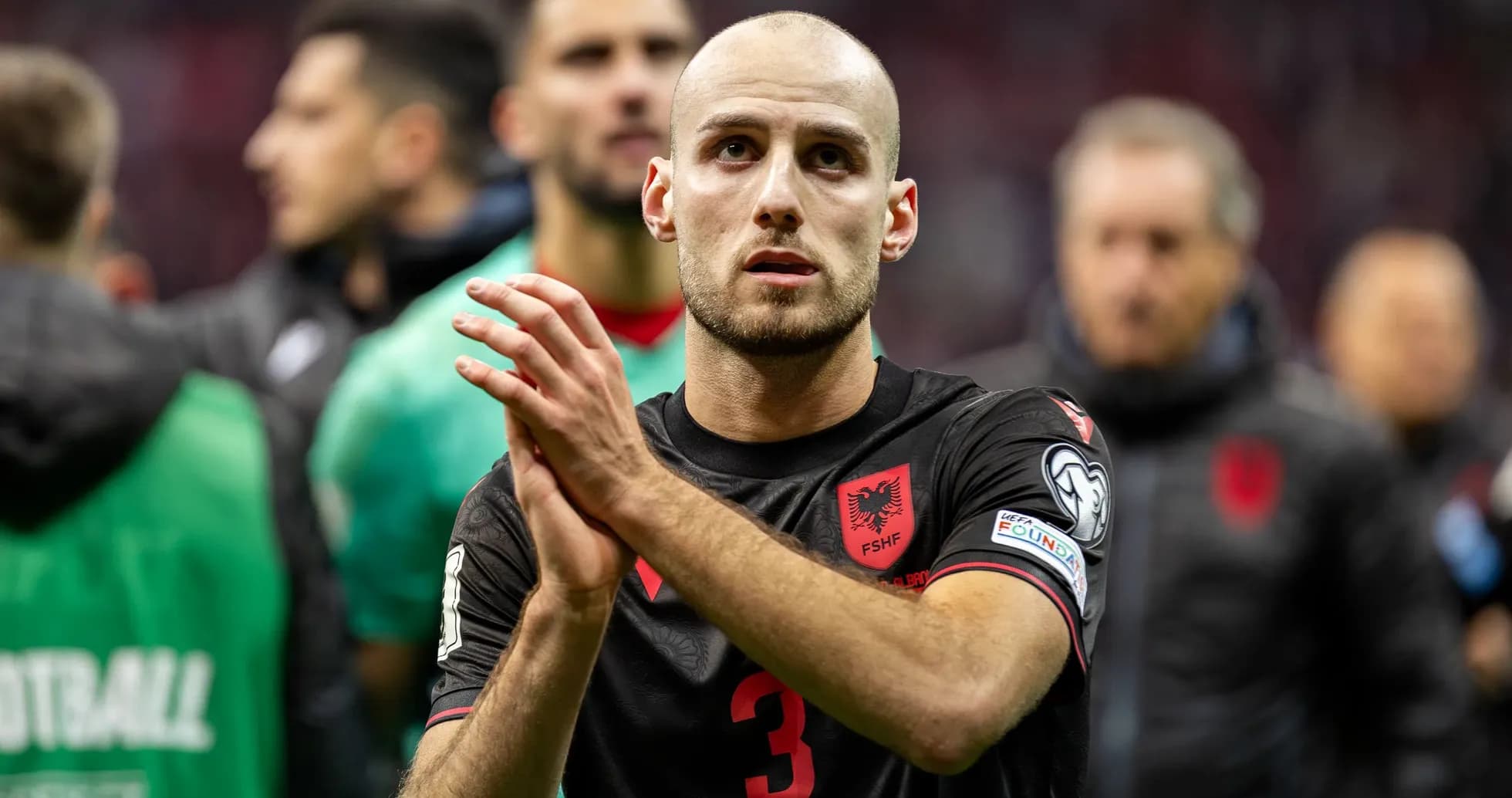 Player applauding after match, wearing Albania jersey Player applauding after match, wearing Albania jersey
