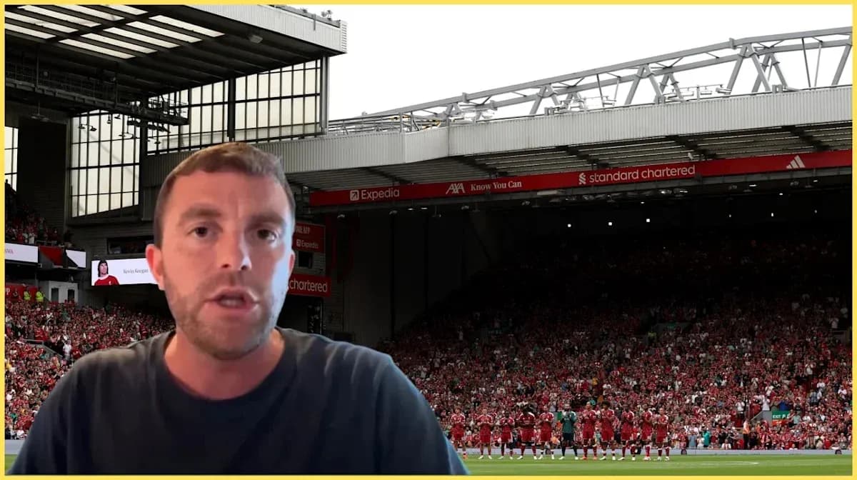 Presenter speaking in front of Anfield stadium crowd Presenter speaking in front of Anfield stadium crowd
