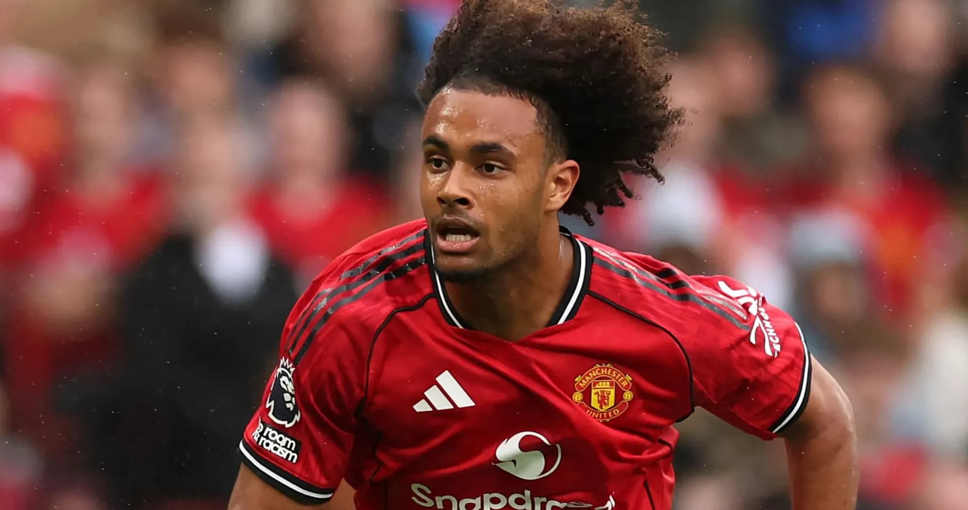 Player sprinting in Manchester United home kit Player sprinting in Manchester United home kit
