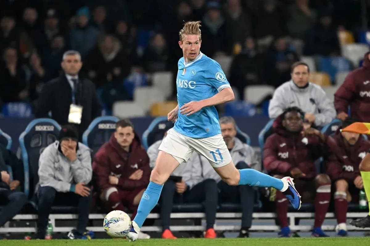 Player in blue jersey running with ball during match Player in blue jersey running with ball during match