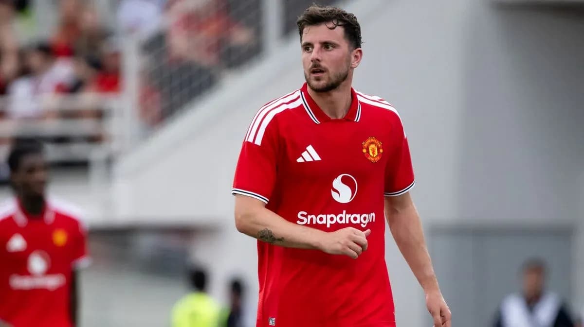 Player in red Manchester United jersey on field Player in red Manchester United jersey on field