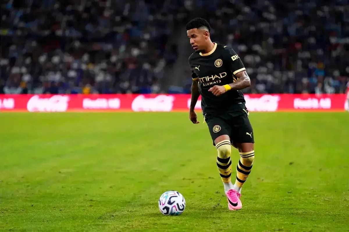 Player dribbling the ball on the pitch Player dribbling the ball on the pitch
