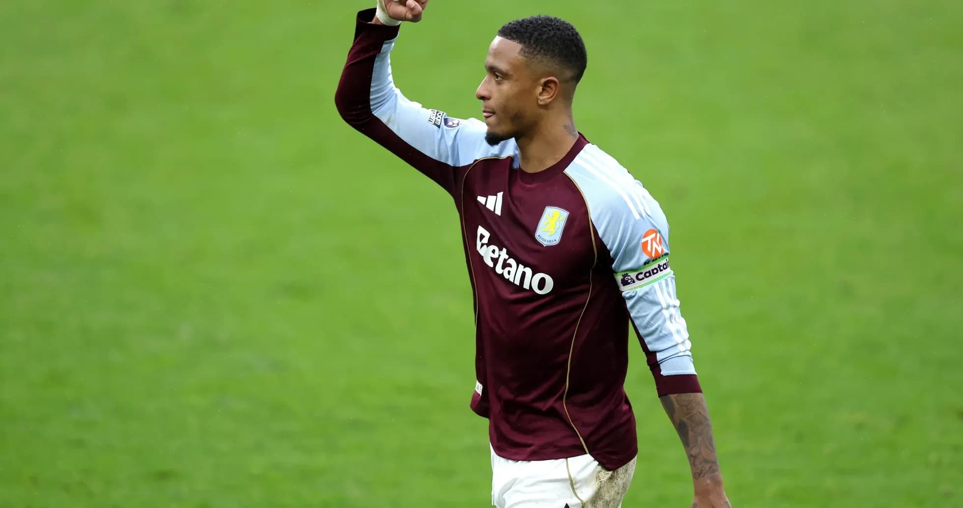 Aston Villa player celebrating on the pitch Aston Villa player celebrating on the pitch