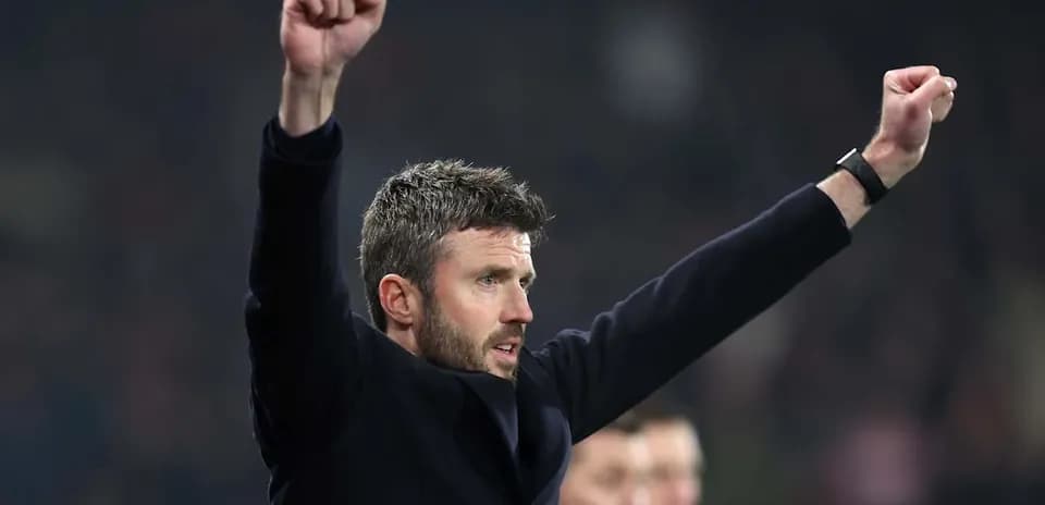 Coach celebrating with raised arms during match Coach celebrating with raised arms during match